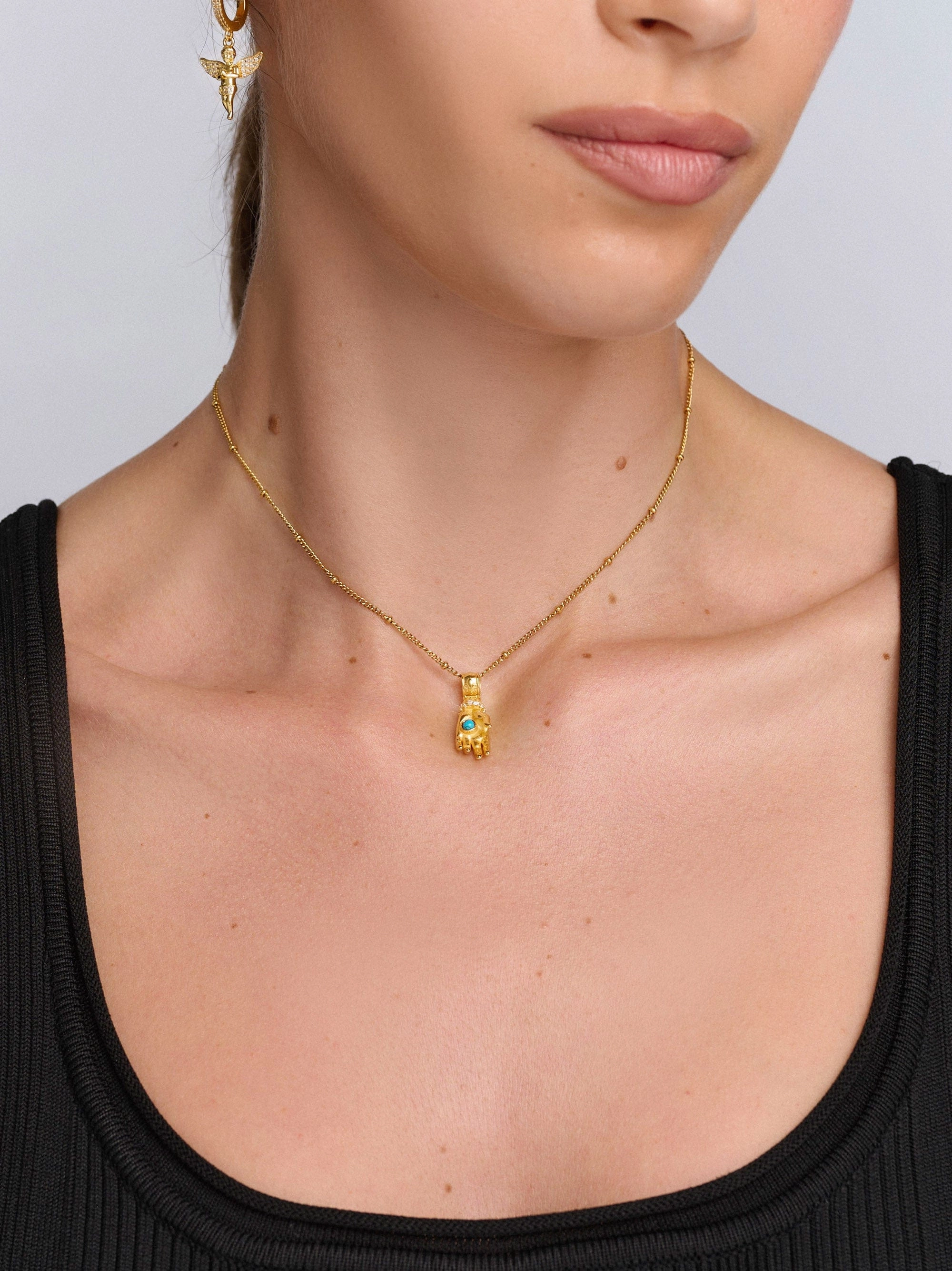 Women’s Hand Pendant with a Small Turquoise Gemstone